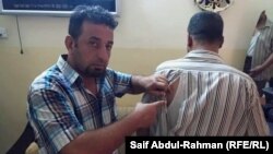 الكوت آثار الضرب على جسم احد الصحفيين