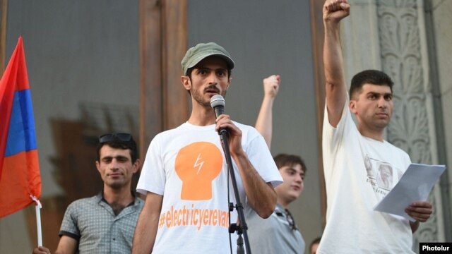 "Electric Yerevan" protest leaders Narek Ayvazian (left) and Davit Sanasarian (right) hold a rally in Liberty Square in Yerevan on July 10. "We continue our fight. We will be successful," says Sanasarian.