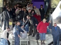 Georgians deported from Russia emerge from a Russian cargo plane on October 6 (epa)