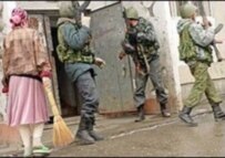 Pro-Moscow Chechen security forces carry out a raid (file photo)