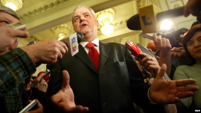 Former Prime Minister Adrian Nastase speaks to the media in 2006.