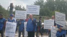A demonstration by metal workers in Kutaisi is broken up on September 16.