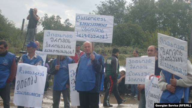 A demonstration by metal workers in Kutaisi is broken up on September 16.