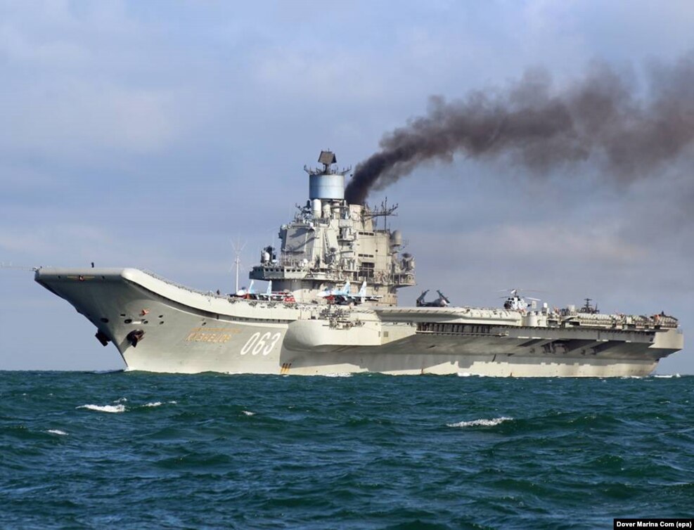 The Admiral Kuznetsov, billowing smoke as it passes through the English Channel on October 21, 2016. The diesel-powered carrier has attracted ridicule on Russian social media for its plume of black exhaust, but the apparent purpose of the vessel's mission to Syria is deadly serious.
