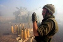 Israeli soldiers firing on positions in Lebanon from northern Israel on July 18 (epa)