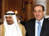 Kuwaiti Foreign Minister Muhammad al-Sabah (left) and Iraqi Prime Minister Nuri al-Maliki at the ministerial conference in Kuwait (AFP)