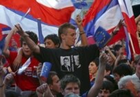 Supporter of union with Serbia wears t-shirt with pictures of war crime fugitives Radovan Karadzic and Ratko Mladic during a pro-union rally on May 14