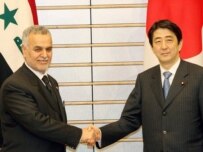 Al-Hashimi with Japanese Prime Minister Shinzo Abe in Tokyo on March 23 (epa)