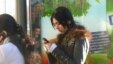 Uzbekistan - Uzbek girl is using a mobile phone, undated