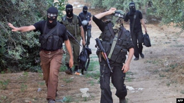 Palestinian Popular Resistance Committees (PRC) fighters return from positions on the border between the Gaza Strip and Israel in 2008.
