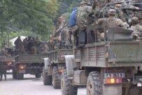 Georgian soldiers leaving the gorge on July 29. Some have questioned their performance. (InterPressNews)