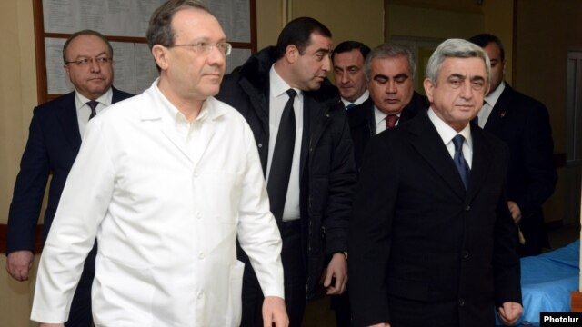 Armenia - President Serzh Sarkisian (R) visits the Surb Grigor Lusavorich hospital in Yerevan where one of his election challengers, Paruyr Hayrikian, is recovering from a gunshot wound, 1Feb2013. 