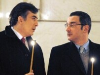 Saakashvili (left) and Prime Minister Lado Gurgenidze at an Orthodox Christmas service in Tbilisi today (InterPressNews)