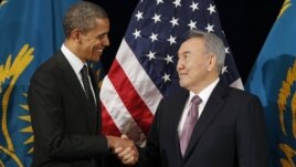 U.S. President Barack Obama greets his Kazakh counterpart Nursultan Nazarbaev at a meeting in Seoul