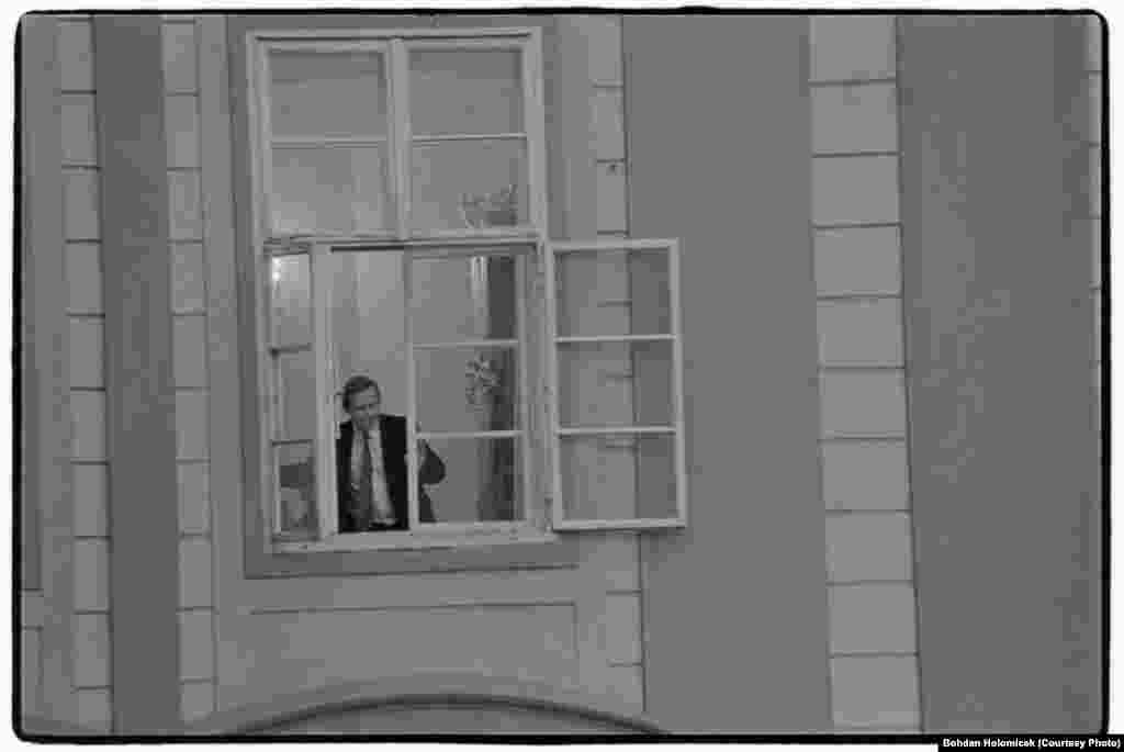 Havel appears in a window of Prague Castle in the early days of his presidency, on February 25, 1990.