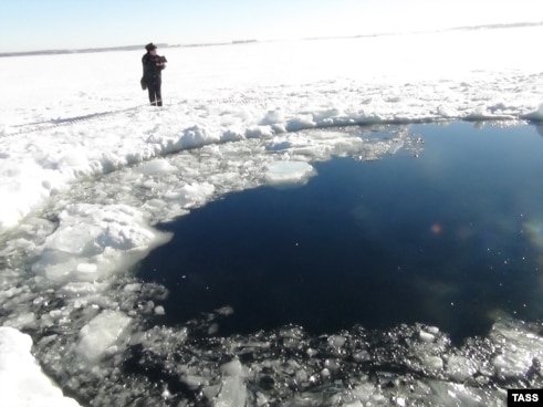 Russia's Emergency Situations Ministry released this photo of a hole in the ice atop a lake in the Chelyabinsk region thought to have been caused by a meteorite from the February 15 incident.