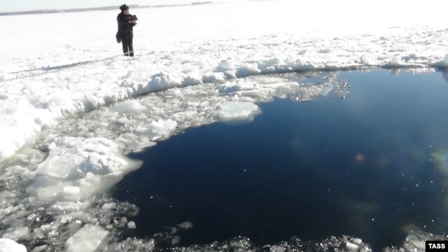 Russia's Emergency Situations Ministry released this photo of a hole in the ice atop a lake in the Chelyabinsk region thought to have been caused by a meteorite from the February 15 incident.