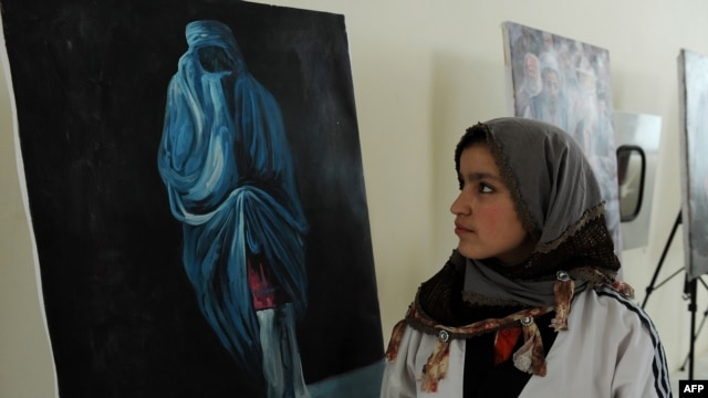 A visitor attends an exhibition in Herat to mark International Women's Day.
