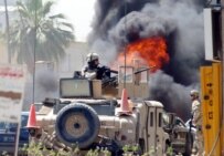 U.S. troops secure site of roadside-bomb explosion in Baghdad on May 29 (epa)