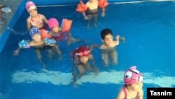 Photos like these, showing young girls and boys swimming together, resulted in a Tehran kindergarten being closed down.