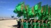 People attend the opening ceremony of a railway link to Afghanistan at a customs control point in Turkmenistan. (Reuters/Marat Gurt)