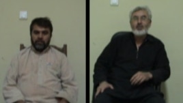 Afghan citizens Syed Kamal (in black) and Syed Hussain were arrested on charges of spying for Iran.