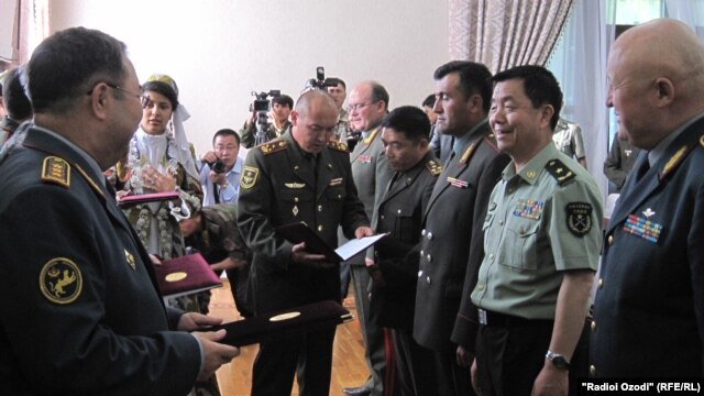 Military officials gather in Tajikistan ahead of the exercises on June 8.