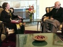 Beckett (left) and Karzai in Kabul today (AFP)
