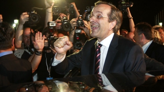 The leader of the conservative New Democracy party, Antonis Samaras, is cheered by supporters in Athens on June 17.