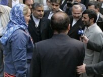 Ahmadinejad (right) greets the Britons (ISNA)