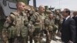 French President Francois Hollande reviews troops during his visit to a military base in Kapisa Province, Afghanistan on May 25.