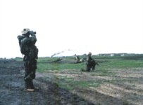 U.S. 3rd Infantry Division troops fight off an Iraqi counterattack near Al-Nasiriya on March 21, 2003 (RFE/RL)