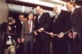 RFE/RL President Thomas A. Dine cuts the symbolic ribbon to begin Radio Free Afghanistan broadcasts on January 30, 2002.