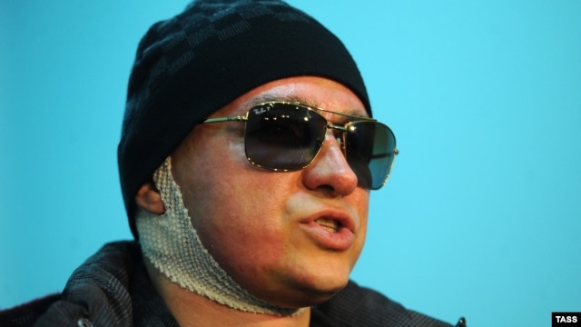 Sergei Filin speaks to journalists as he leaves a Moscow hospital on February 4.
