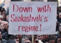 Georgian protesters take part in an opposition rally in front of the Georgian parliament in Tbilisi on March 30 (epa)