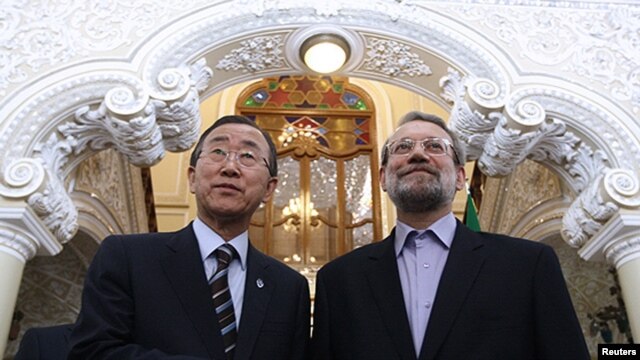 Iranian Parliament Speaker Ali Larijani (right) with UN Secretary-General Ban Ki-moon after he gave a speech upon his arrival in Tehran on August 29 ahead of the NAM summit. 