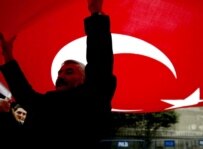Turks demonstrate in Istanbul against a bill in the French to parliament to criminalize denial of the \