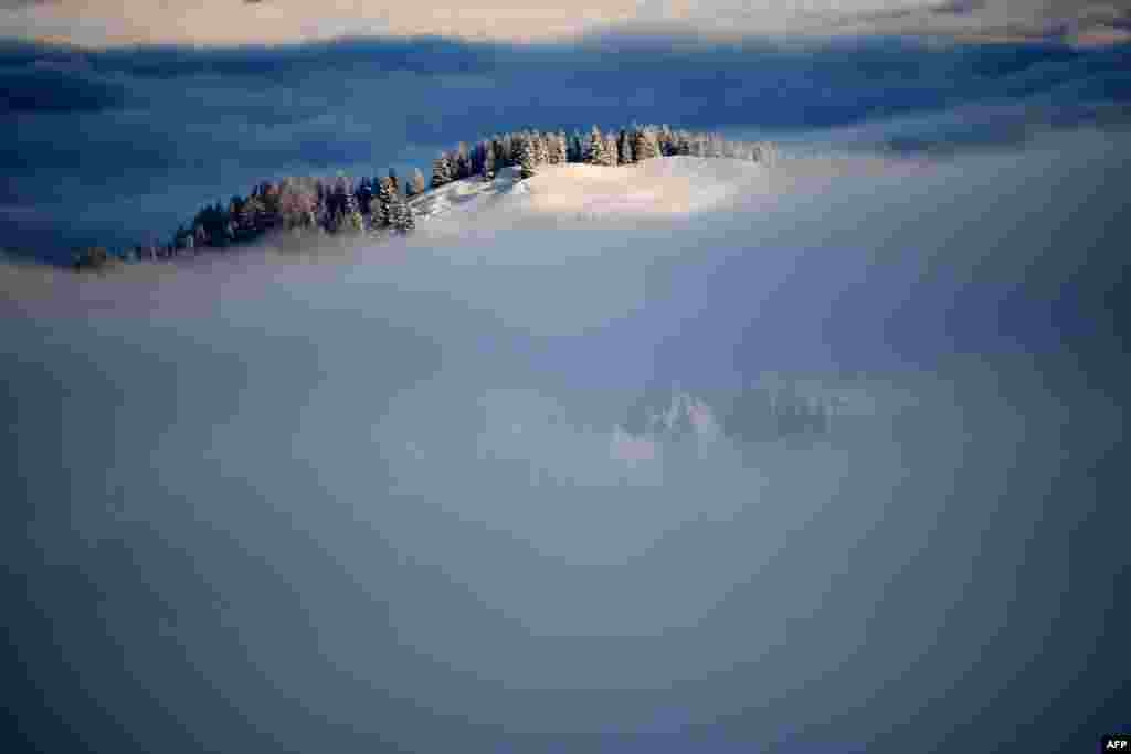 Fog partially covers the Dolomites before the Men's World Cup Giant Slalom in Alta Badia. (AFP/Olivier Morin)
