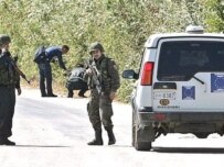 A special Macedonian police unit secures the road into the village of Vaksince, site of a deadly shoot-out on September 10 (AFP)
