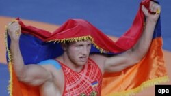 Armenian wrestler Artur Aleksanyan celebrates winning the gold medal in the Greco-Roman 98-kilogram category at the Olympic Games in Rio.