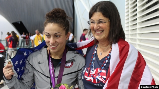 Georgia-born U.S. Paralympic swimmer Elizabeth Stone (left) with her adoptive mother, Linda, at the London 2012 Games.