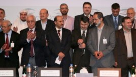 Pjesetarë të grupit opozitar sirian