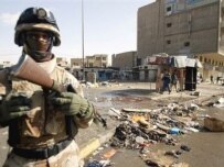 An Iraqi soldier at the site of the Al-Ghazil market (AFP)
