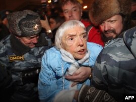 Russian riot police arrest Lyudmila Alekseyeva at a Moscow rally on December 31.
