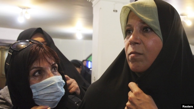 Faezeh Hashemi (right) attends a protest at a mosque in northern Tehran in 2009.