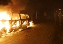 A car is ablaze in a Paris suburb on 6 November (AFP)