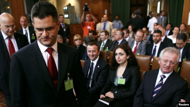 Serbia's Foreign Minister Vuk Jeremic (second from the left) arrives at the International Court of Justice at the Peace Palace in The Hague as Kosovo's Foreign Minister Skender Hyseni (right) looks on July 22.