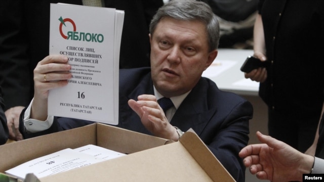 The founder of the liberal Yabloko Party, Grigory Yavlinsky, who was recently disqualified from the March 4 presidential election and is seen here with a box of signatures backing his candidacy, will address the rally in Moscow.