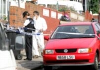 Police search the area near the Leeds house of suspects connected to the London bombings