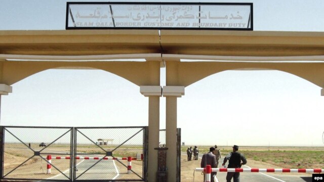 Afghan customs officers man a checkpoint at the Iranian border. But Iran's influence in Afghanistan is felt in more than just commerce.